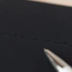 VENT For Change Make A Mark Journal A5 -Stationery Sale Shop Recycled Leather A5 lined notebook Charcoal Grey Logo Close up lifestyle